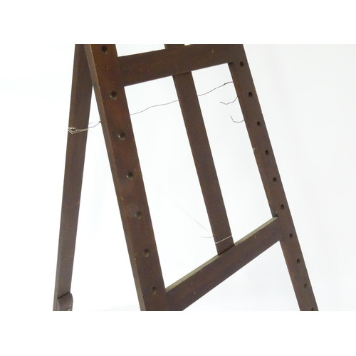 104 - An adjustable artist's easel, marked Newman.