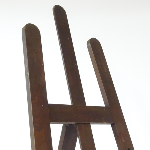 104 - An adjustable artist's easel, marked Newman.