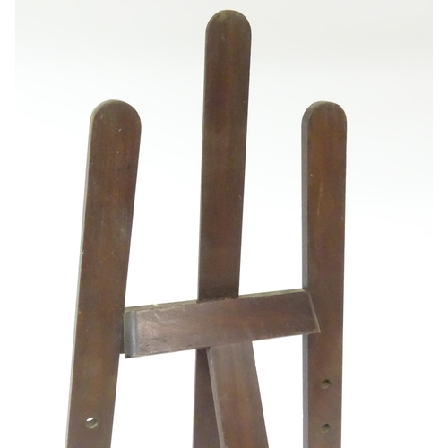 104 - An adjustable artist's easel, marked Newman.