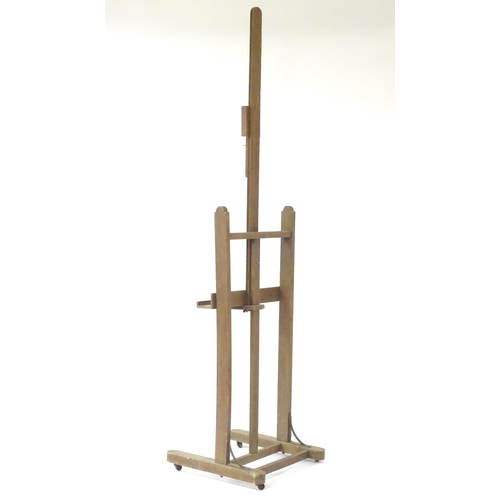 105 - An adjustable artist's easel, marked Bourgeois Aine.