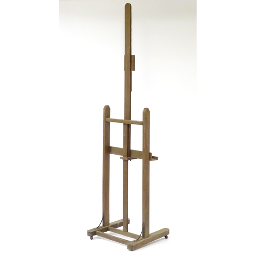 105 - An adjustable artist's easel, marked Bourgeois Aine.