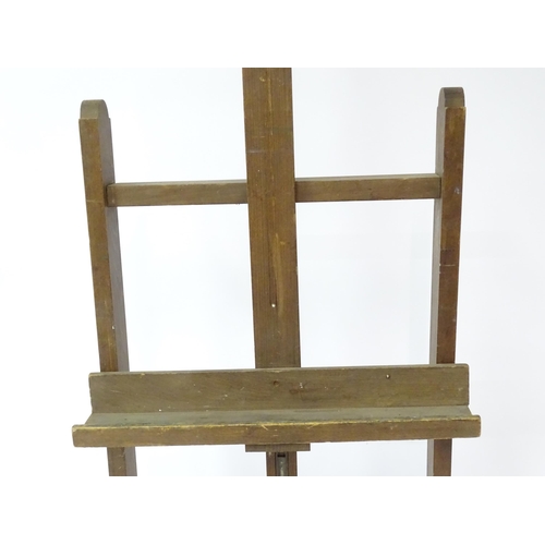 105 - An adjustable artist's easel, marked Bourgeois Aine.