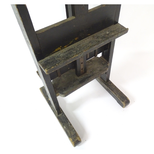 106 - An adjustable artist's easel, marked Roberson & Co. 99 Longacre, London.