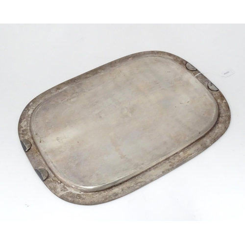 941 - A large silver plate tray with engraved decoration. Approx. 22 1/2