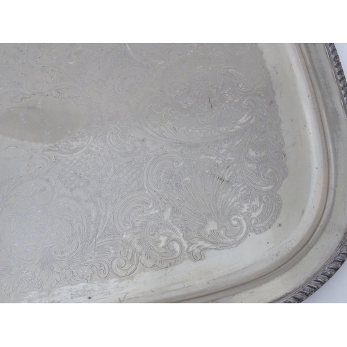 941 - A large silver plate tray with engraved decoration. Approx. 22 1/2