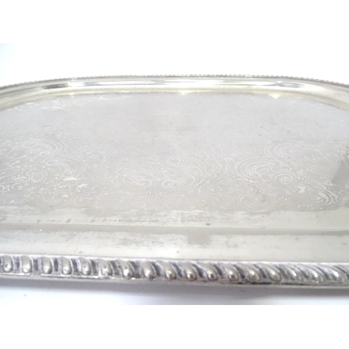 941 - A large silver plate tray with engraved decoration. Approx. 22 1/2