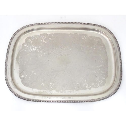 941 - A large silver plate tray with engraved decoration. Approx. 22 1/2