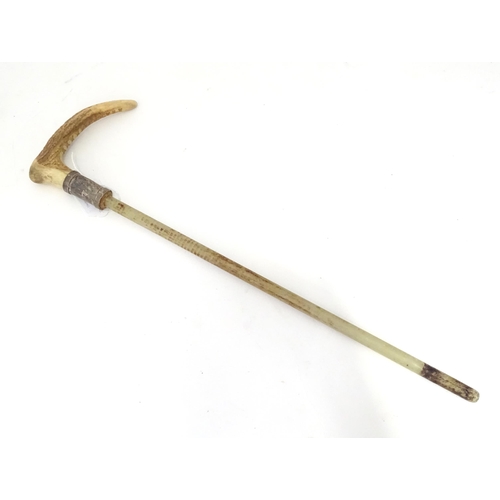 944 - A mid 20thC riding crop mount, with antler handle, silver collar and fibreglass core. Approx 20 1/4