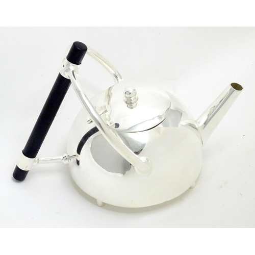 943 - A silver plate kettle copied from a design by Christopher Dresser.