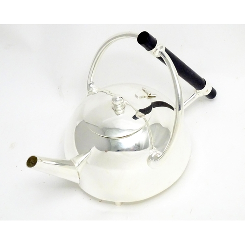 943 - A silver plate kettle copied from a design by Christopher Dresser.