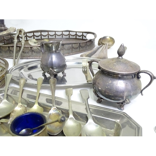 950 - A quantity of assorted silver plated wares to include various trays, flatware, candelabra, milk jug,... 