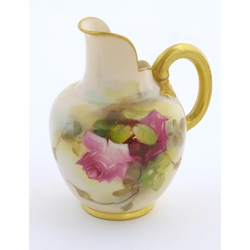 106 - A Royal Worcester flatback jug with a shaped spout, with painted decoration depicting rose flowers a... 