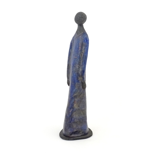 77 - A studio pottery model of a woman in a blue dress. In the manner of Elizabeth Rollins Scott. Incised... 