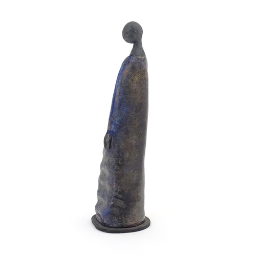 77 - A studio pottery model of a woman in a blue dress. In the manner of Elizabeth Rollins Scott. Incised... 