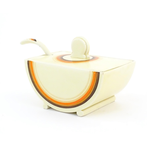 89 - A Clarice Cliff Bizarre sauce boat and ladle in the pattern Biarritz. Sauce boat marked under The Bi... 