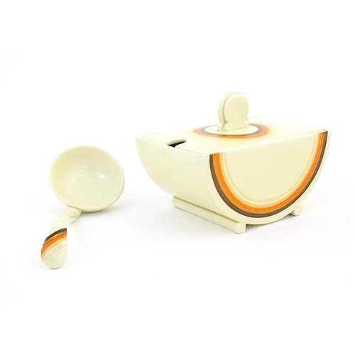 89 - A Clarice Cliff Bizarre sauce boat and ladle in the pattern Biarritz. Sauce boat marked under The Bi... 