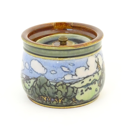 103 - A Royal Doulton stoneware tobacco jar with landscape decoration. Marked under with maker's mark DJ, ... 