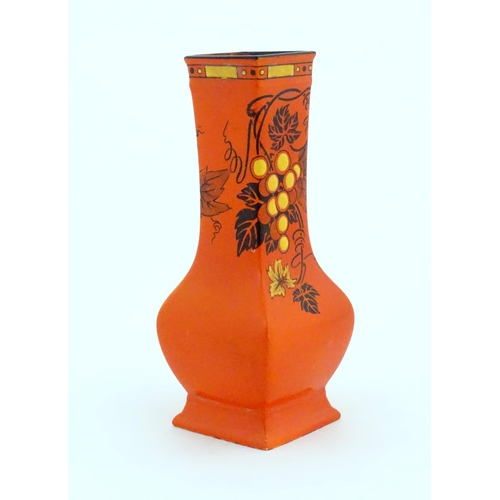 127 - A Shelley vase with a burnt orange ground decorated in the pattern Vine & Grapes. Marked under, with... 