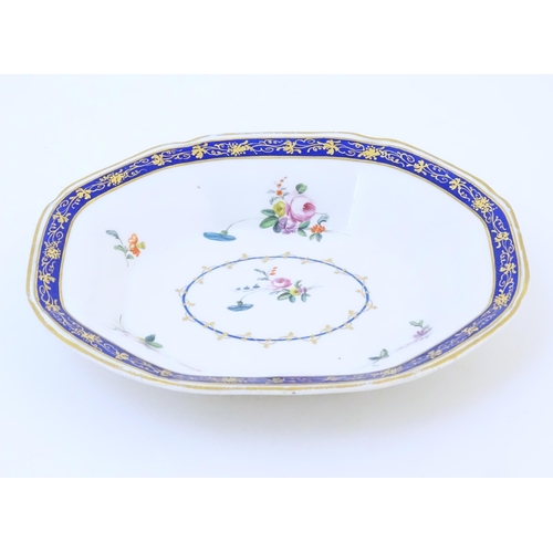 62 - A Derby serving dish decorated with flowers and foliage. Marked under. Approx. 7 3/4