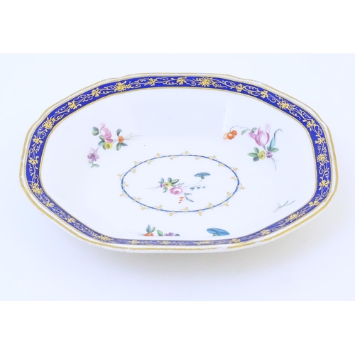 62 - A Derby serving dish decorated with flowers and foliage. Marked under. Approx. 7 3/4