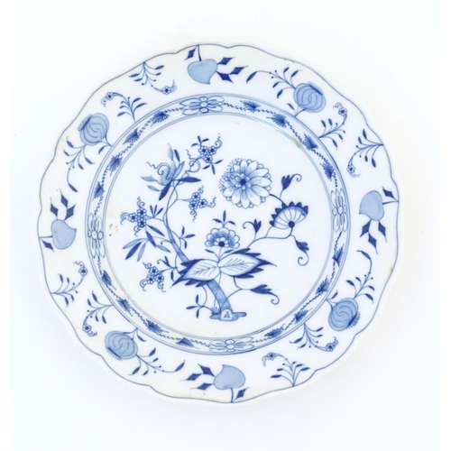 63 - A Meissen style blue and white plate decorated in the Onion pattern. Crossed sword mark under. Appro... 