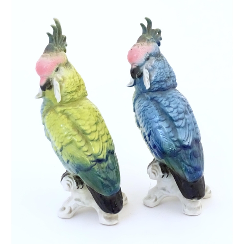 96 - Two Karl Ens models of parrots / cockatiels in blue and yellow with pink heads. Marked under. Approx... 