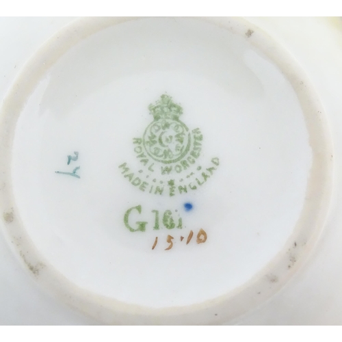 105 - A Grainger & Co. Worcester pot with swag and garland detail. Together with a Royal Worcester pot wit... 