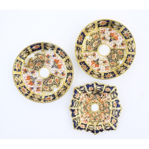 114 - A Royal Crown Derby coffee cup and saucer decorated in the Imari pattern. Marked under no. 2451. Tog... 