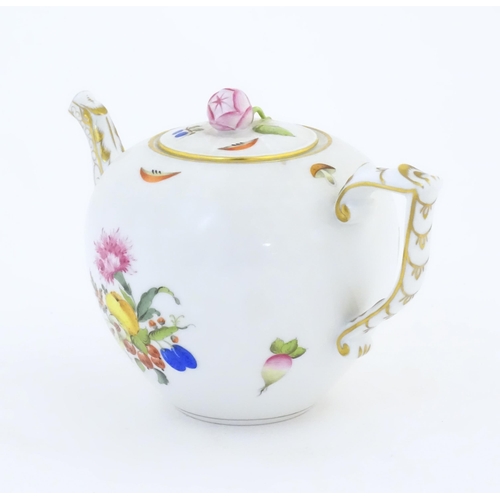 116 - A Herend pottery teapot decorated in the pattern Fruits & Flowers, with gilt highlights and a rose b... 