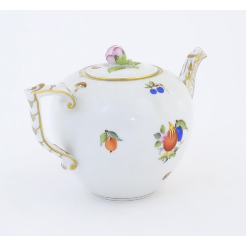 116 - A Herend pottery teapot decorated in the pattern Fruits & Flowers, with gilt highlights and a rose b... 