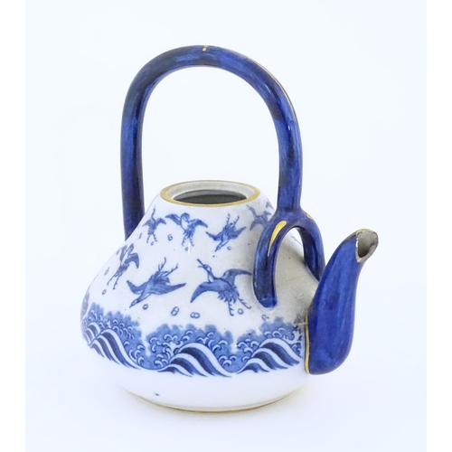 117 - A Minton teapot decorated in the pattern Japanese Crane, designed by Christopher Dresser, with crane... 