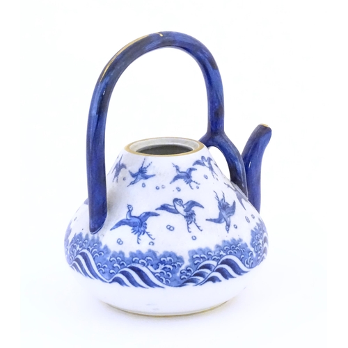 117 - A Minton teapot decorated in the pattern Japanese Crane, designed by Christopher Dresser, with crane... 