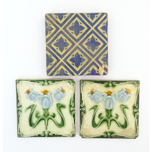 120 - Two Art Nouveau tile with floral and foliate detail. Together with an earthenware tile with repeatin... 