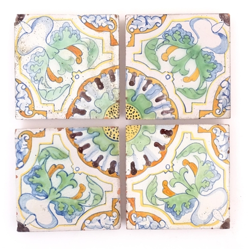 121 - Four terracotta tiles with floral and foliate motifs, by Frederick Garrard at the Millwall Pottery, ... 