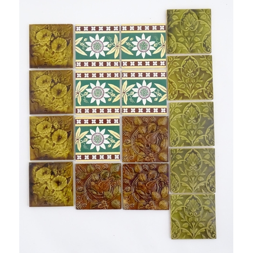 125 - A quantity of Victorian and later tiles to include floral and foliate designs, passion flowers, pome... 