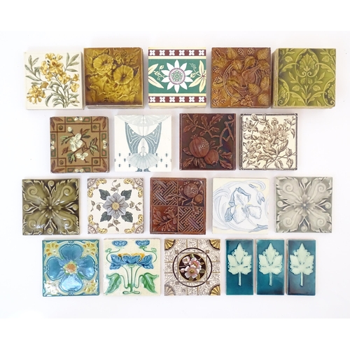 125 - A quantity of Victorian and later tiles to include floral and foliate designs, passion flowers, pome... 