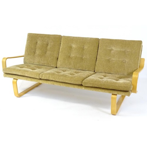 1776 - A late 20thC suite in the manner of Alvar Aalto, comprising a three seater sofa with a bentwood fram... 