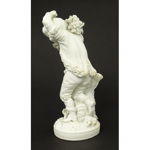 65 - A Derby bisque porcelain figure from The Seasons modelled as Autumn, a boy holding crops on a natura... 