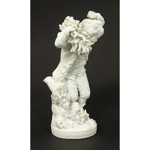 65 - A Derby bisque porcelain figure from The Seasons modelled as Autumn, a boy holding crops on a natura... 