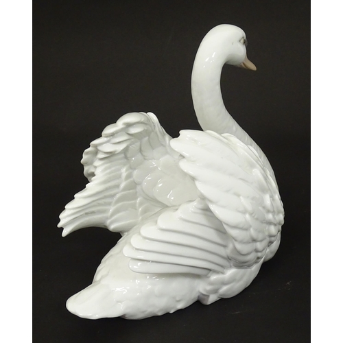 99 - A Lladro model of a swan, model no. 5231. Marked under. Approx. 7