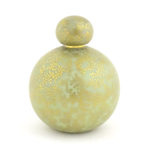 107 - A Royal Worcester scent bottle of globular form decorated with a turquoise ground and gilt foliate d... 