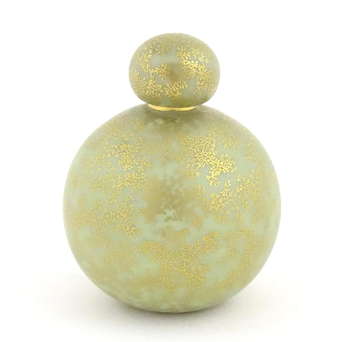 107 - A Royal Worcester scent bottle of globular form decorated with a turquoise ground and gilt foliate d... 