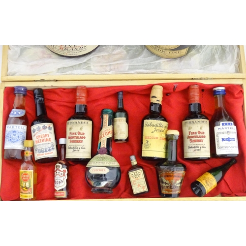 1060 - An old wicker hamper containing assorted fortified wines / spirits / liqueurs, etc. to include Cherr... 