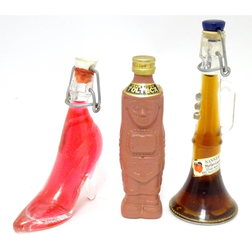 1061 - Spirits / Liqueurs etc.: A quantity of assorted novelty miniature bottles to include examples for Wi... 