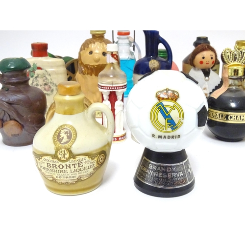 1061 - Spirits / Liqueurs etc.: A quantity of assorted novelty miniature bottles to include examples for Wi... 