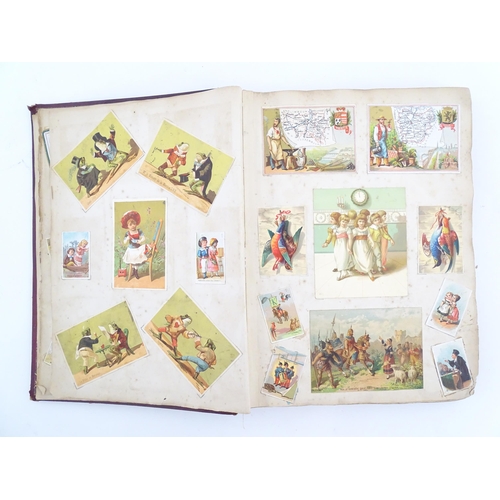 2048 - A Victorian scrapbook / album with applied dog detail to cover, to include various engravings, clipp... 