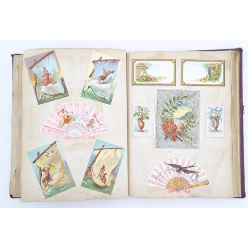 2048 - A Victorian scrapbook / album with applied dog detail to cover, to include various engravings, clipp... 