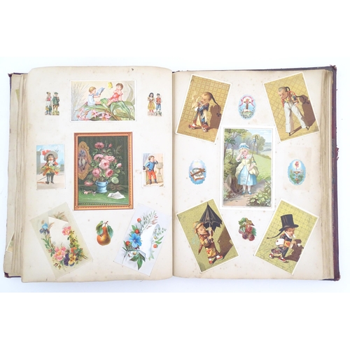 2048 - A Victorian scrapbook / album with applied dog detail to cover, to include various engravings, clipp... 