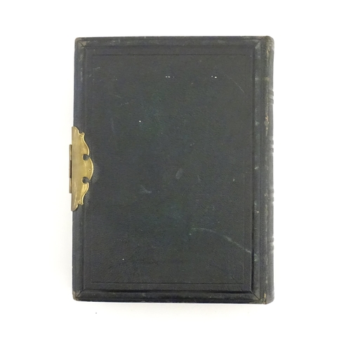 2049 - A Victorian leather bound scrapbook / album with metal clasp to include various engravings, clipping... 