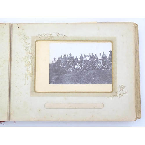 2050 - A late 19thC South African photograph album to include Swazi beehive huts, portraits of nurses, mili... 